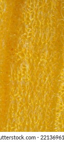 closeup, background, texture, large long vertical banner. heterogeneous surface structure bright saturated yellow sponge for washing dishes, kitchen, bath. full depth of field. high resolution photo - Shutterstock ID 2213696115