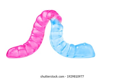 Close-up Of A Backlit Rose-blue Gummy Worm Isolated On White.