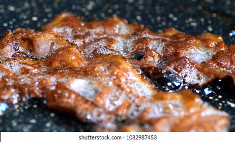 Close-up of a Bacon Fried On Grill - Powered by Shutterstock