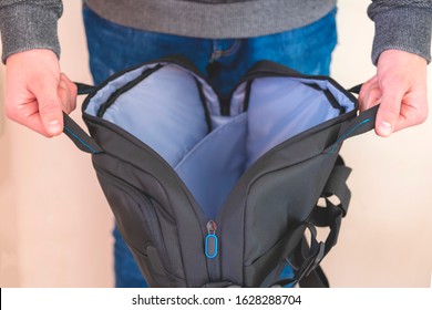 Close-up. Bag In Hand, Man Holds An Open Bag In His Hands, The Concept Of Empty Bag, A Protective Folder For A Laptop