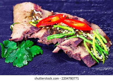 Close-up Of Baked Beef With Leek And Hot Chili Pepper