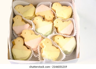 Closeup Of Baked Easter Cookies In Bakery Box. Top View