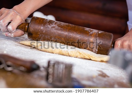close-up of bakery production making bread with flour eggs rolling pin or rolling pin oil on wooden base background green field with sun in vacations cordoba argentina