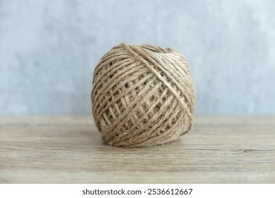 Close-Up of a Ball of Twine on Wooden Surface - Powered by Shutterstock