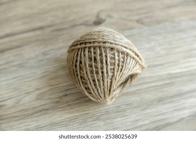 Close-Up of a Ball of Twine on Wooden Surface - Powered by Shutterstock