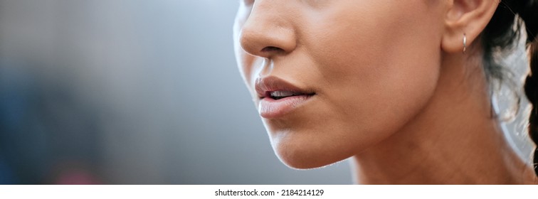 Closeup Banner Of A Womans Face, Mouth And Chin With Blurred Copy Space. Young Female Looking Confident, Focused And Determined. Breathing Deeply While Getting Ready And Preparing For A Challenge