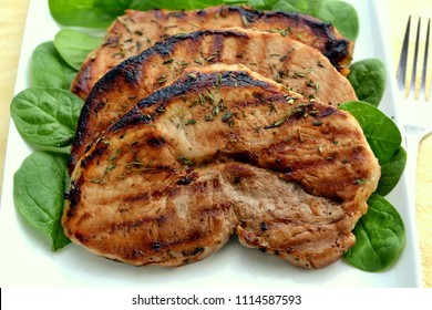 Close-up Of Barbecued Center Cut Pork Chop With Nice Grill Marks Showing: Selective Focus, Viewed From Above