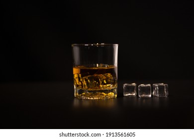 Closeup Barman pouring whiskey into glass