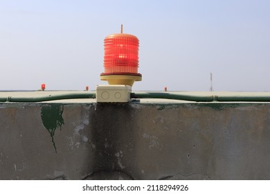 Close-up Barricade Lights Red Warning Light.
On A Tall Building