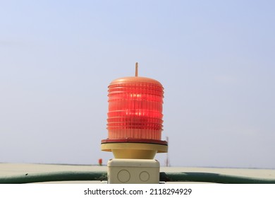 Close-up Barricade Lights Red Warning Light.
On A Tall Building