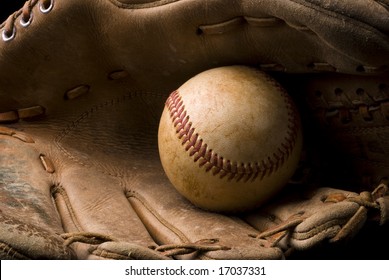 Closeup Of A Baseball In An Old Glove