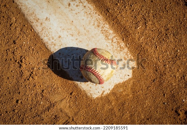 Close-up\
of baseball on pitcher\'s mound on sports\
field