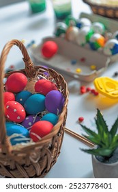 Closeup of basket with Easter eggs.