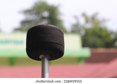 Closeup Of Bass Drum Stick Isolated Above Blurry Background