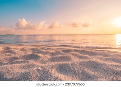 Closeup beach coast sand texture with warm gold orange sunset light. Fantasy beach landscape sky sea bay. Tranquil relax bright horizon, colorful sky. Peaceful nature seascape. Summer Mediterranean
