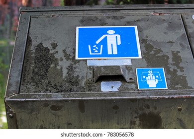 Closeup Of A Bear Proof Garbage Container Latch And Sign.