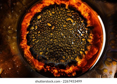 Close-up of beautiful abstract patterns created with ferromagnetic liquid and other chemical agents.