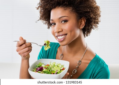 Close-up Of Beautiful African American Woman Eating Salad At Home - Shutterstock ID 131983145