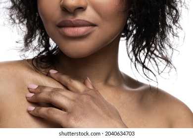 Closeup Of Beautiful Black Woman With A Smooth Skin Is Touching Her Clavicle