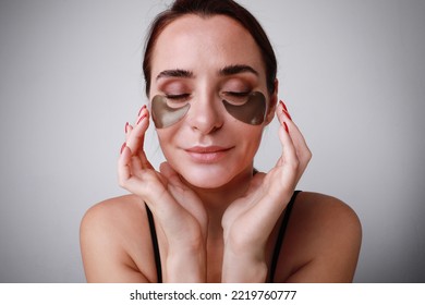 Close-up Of Beautiful Caucasian Woman With Hydrogel Eye Patch Isolated On White.