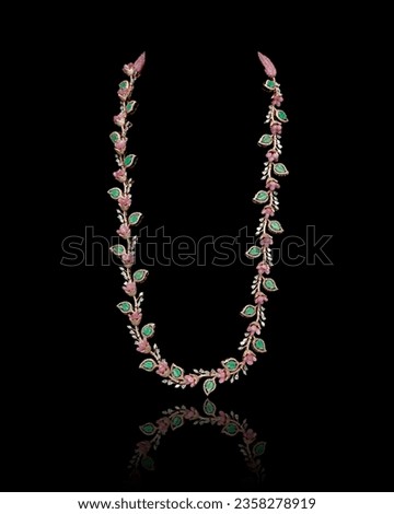Close-up of a beautiful designer Diamond Necklace. Isolated on a black background. Front view.