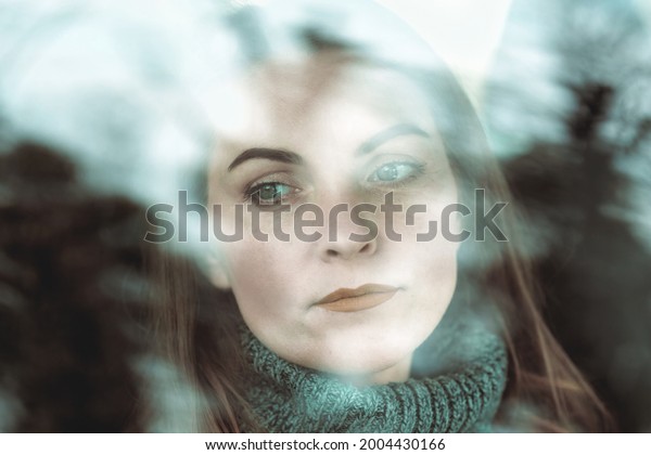 Close-up beautiful face of woman 40 years old\
through car glass, Red\
lipstick