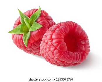 Close-up of beautiful fresh ripe raspberries with green leaves isolated on white background, side view