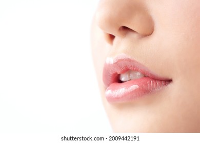 Close-up Beautiful Lips. Part Of Face, Young Asian Woman Close Up. Sexy Plump Lips Nude Lipstick, On White Background.