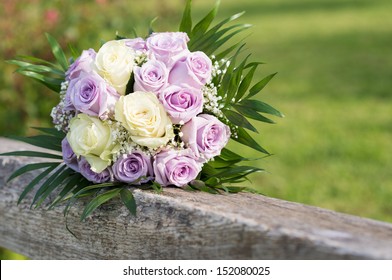 Closeup Of A Beautiful Rose Bouquet On Wooden Railing 