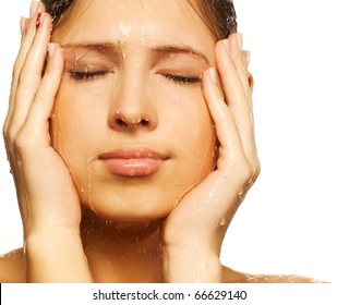  Close-up of beautiful wet woman face with water drop. On white background