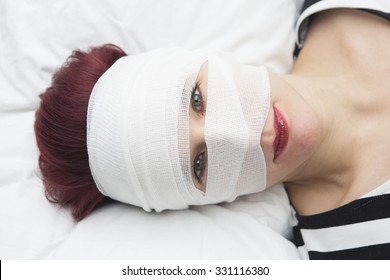 head wrapped in bandages