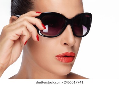 Close-up of a beautiful woman showcasing fashionable oversized sunglasses with a flawless makeup look. Perfect for beauty and fashion themes. Isolated on white. - Powered by Shutterstock