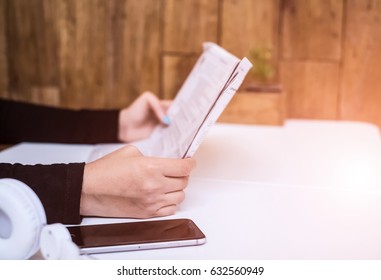 Closeup beautiful woman'hand holding holding newspaper,reading at cafe in the morning ,relax concept - Shutterstock ID 632560949