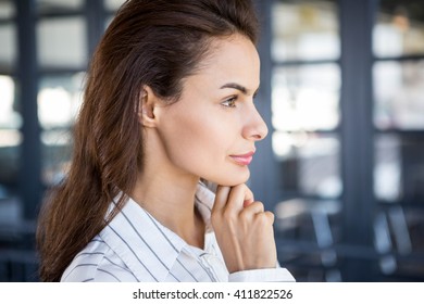 Close-up of beautiful young businesswoman in office - Shutterstock ID 411822526