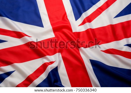 Closeup beautifully wavingof UK British flag Union Jack flag background