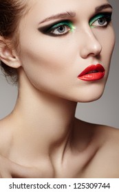 Closeup Beauty Portrait Of Attractive Model Face With Bright Visage. Green Eye Makeup And Red Lips Make-up. Evening Winter Style With Red Lips