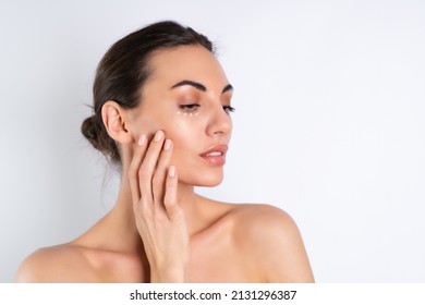 Close-up Beauty Portrait Of A Topless Woman With Perfect Skin And Natural Make-up, With Anti-aging Cream Dots To Moisturize And Firm The Skin Under The Eyes	