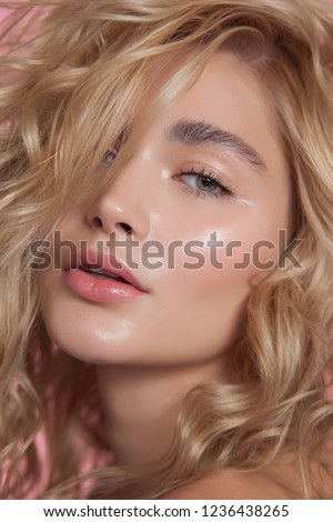close-up beauty portrait. young model with glowing healthy skin. beautiful blonde woman with natural make-up
