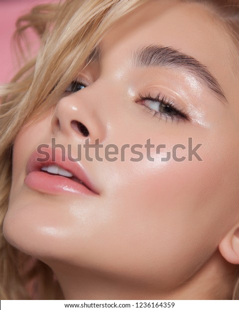 close-up beauty portrait. young model with glowing healthy skin. beautiful blonde woman with natural make-up