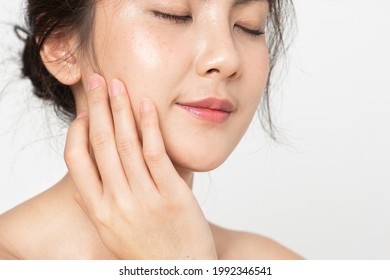 Closeup beauty skin face.  Asian woman with beauty face touching healthy facial skincare. Beautiful girl model with fresh skin face touching  skin face on white background.