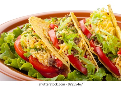 Closeup Of Beef Tacos Served With Salad And Fresh Tomatoes Salsa On White Background