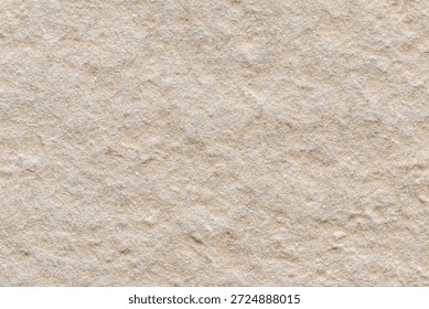 Close-up of the beige surface of the rough gres tile, classified as the highest slip resistance class (R13).