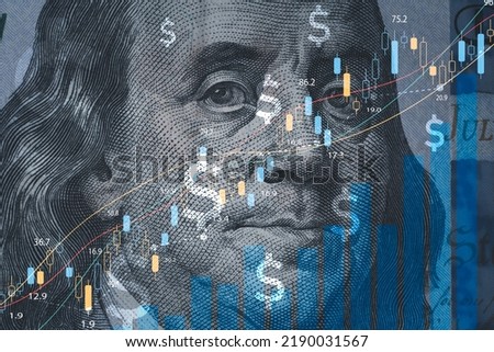 Closeup Benjamin Franklin face on USD banknote with stock market chart graph and dollar sign for currency exchange and global trade forex concept.
