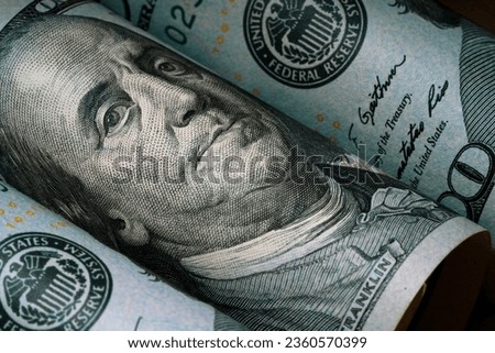 Closeup of Benjamin Franklin face on USD dollar banknote for dollar is the main of currency exchange in the world.