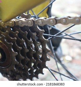 Closeup Bicycle Gear Wheels, Mechanic Gears Cassette And Chain At The Rear Wheel Of Folding Bike