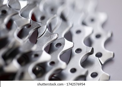 Close-up of bicycle roller chain that transfers power from pedals to drive. Macro shot of metal wheel detail for vehicle. Rear cassette in mountain bike. Transport component concept - Powered by Shutterstock