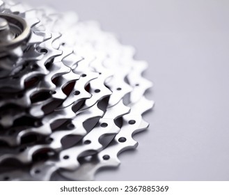 Close-up of bicycle roller chain that transfers power from pedals to drive. Macro shot of metal wheel detail. Rear cassette in mountain bike. Transport component concept