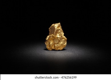 Closeup Of Big Gold Nugget On A Black Background