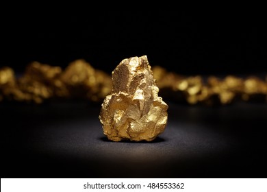 Closeup Of Big Gold Nugget On A Black Background