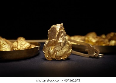 Closeup Of Big Gold Nugget On A Black Background